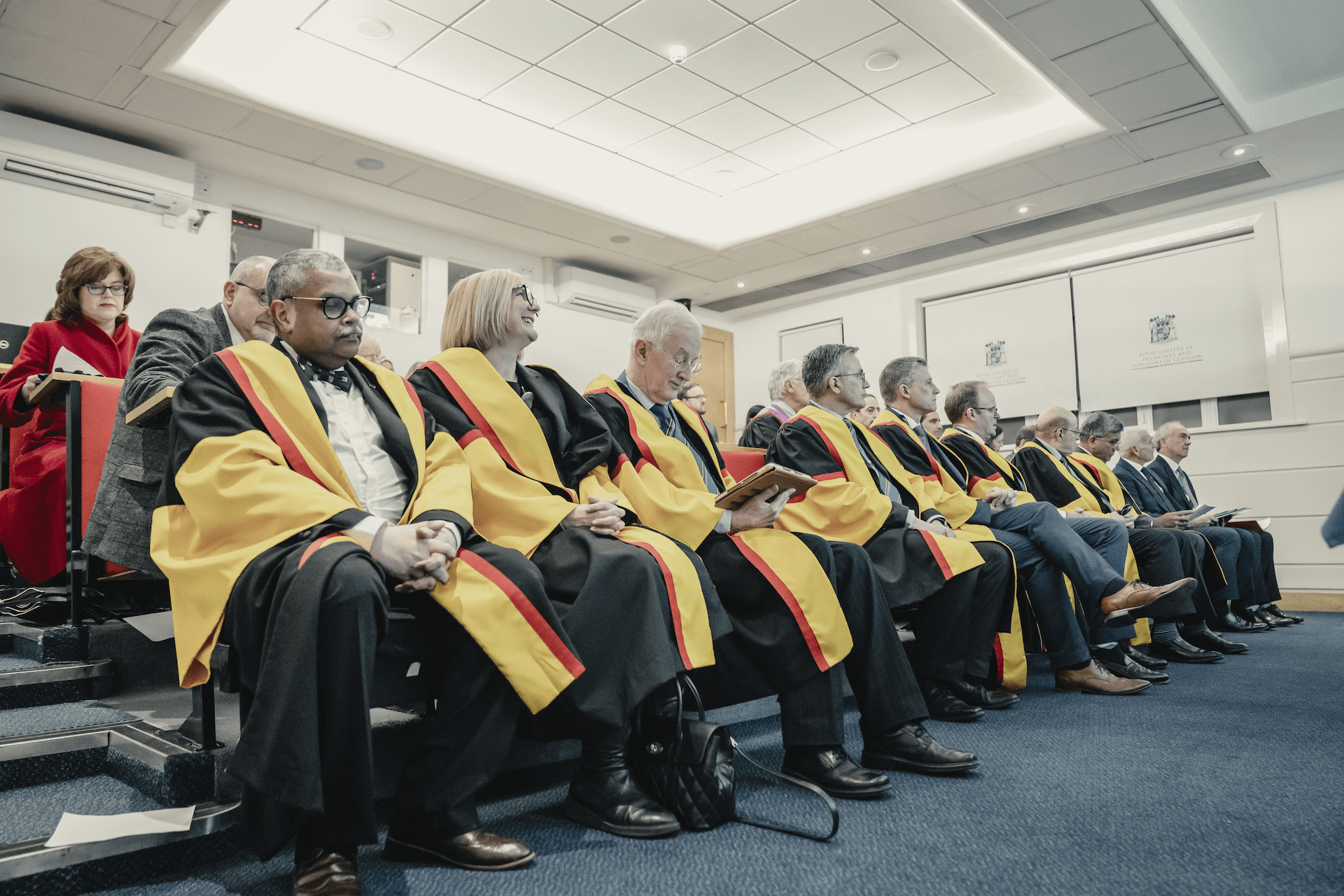 A formal seated portrait of the College trustees