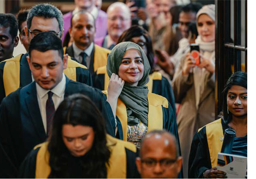 people walking who have just graduated