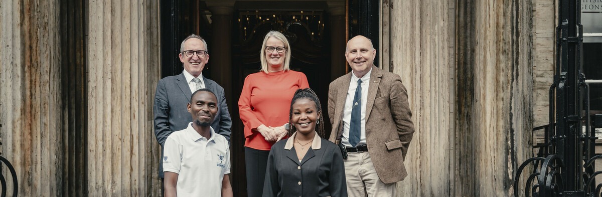 Dental graduates standing outside of the Royal College