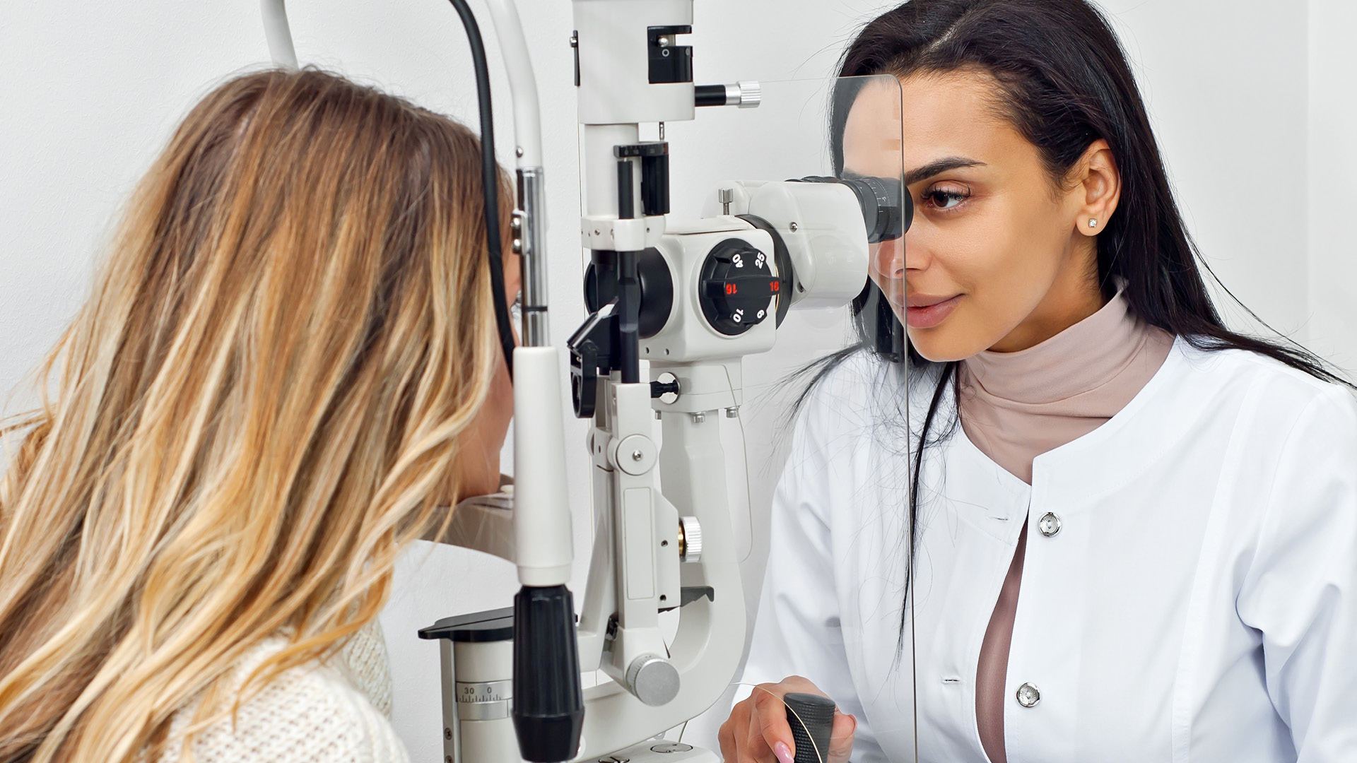 Ophthalmologist using clinical equipment