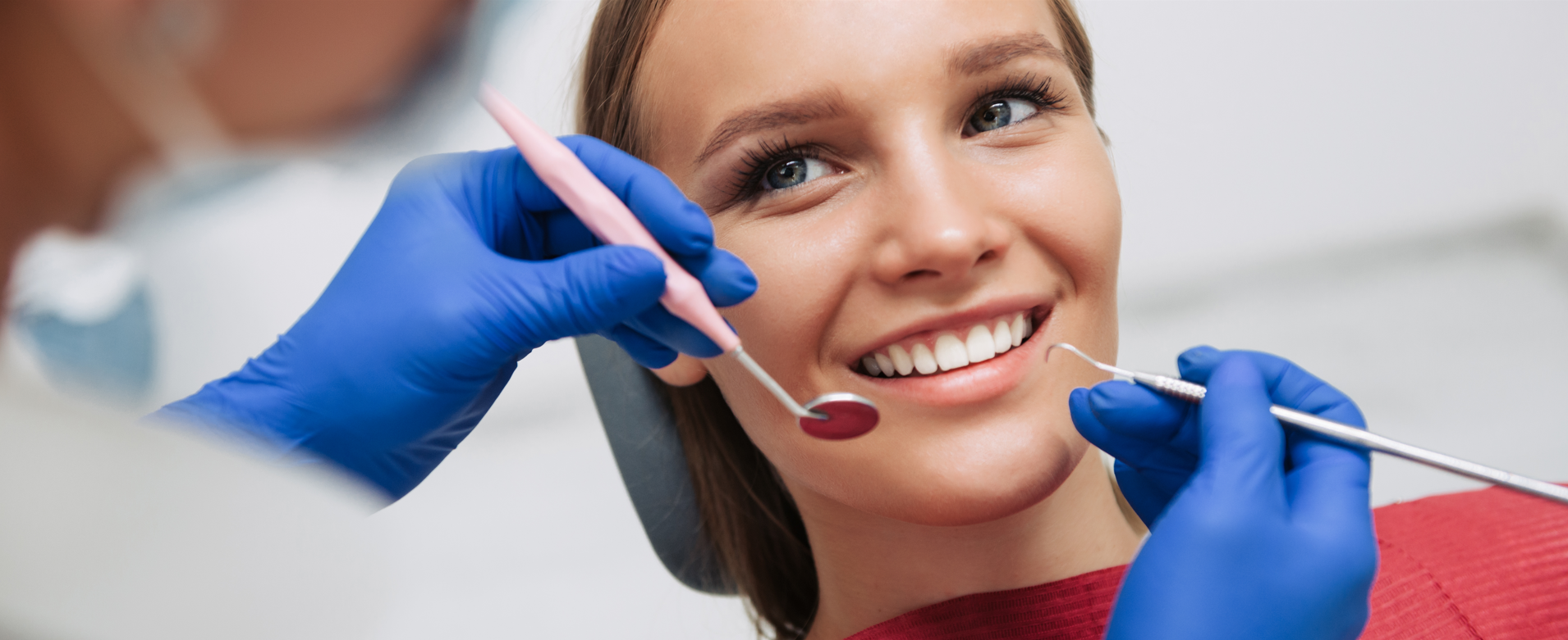Woman smiling with dentist who is about to carry out check up